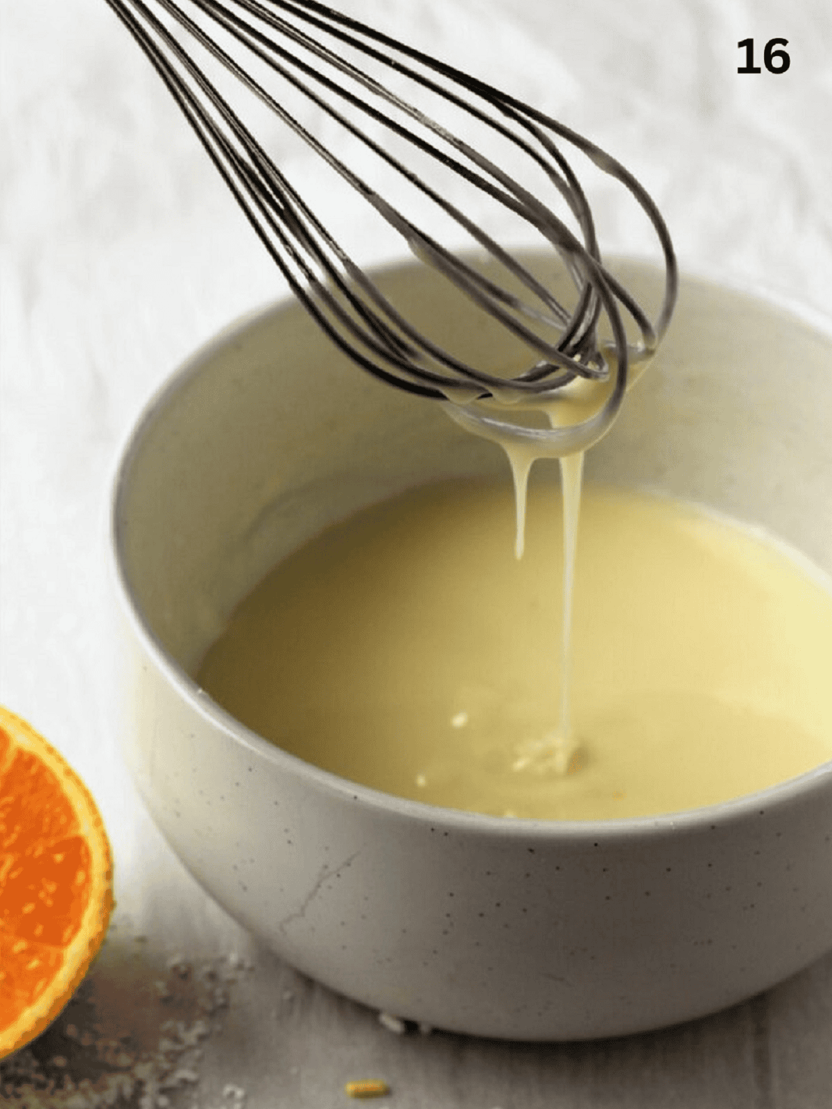 Whisked glaze for cuccidati cookies in bowl.
