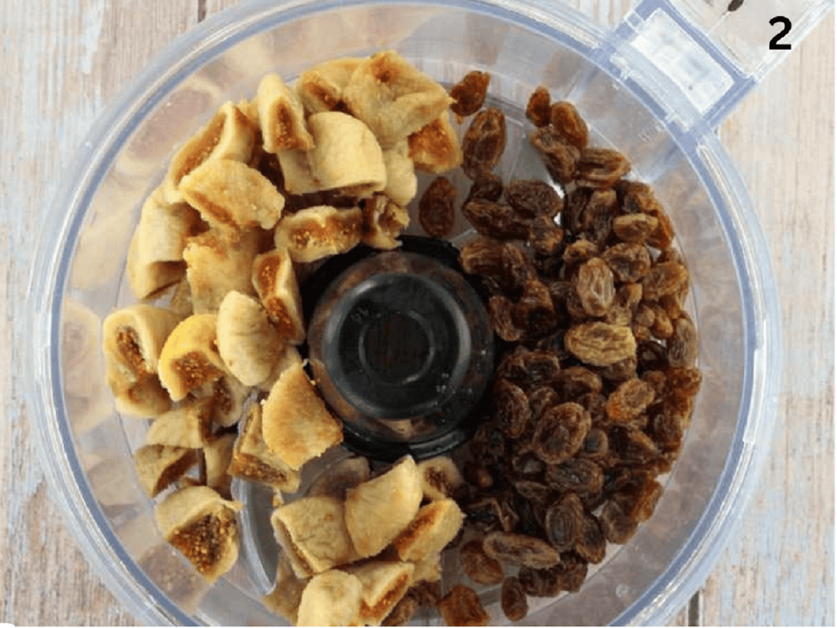 Dry figs, raisins and almonds in food processor bowl for cuccidati filling.