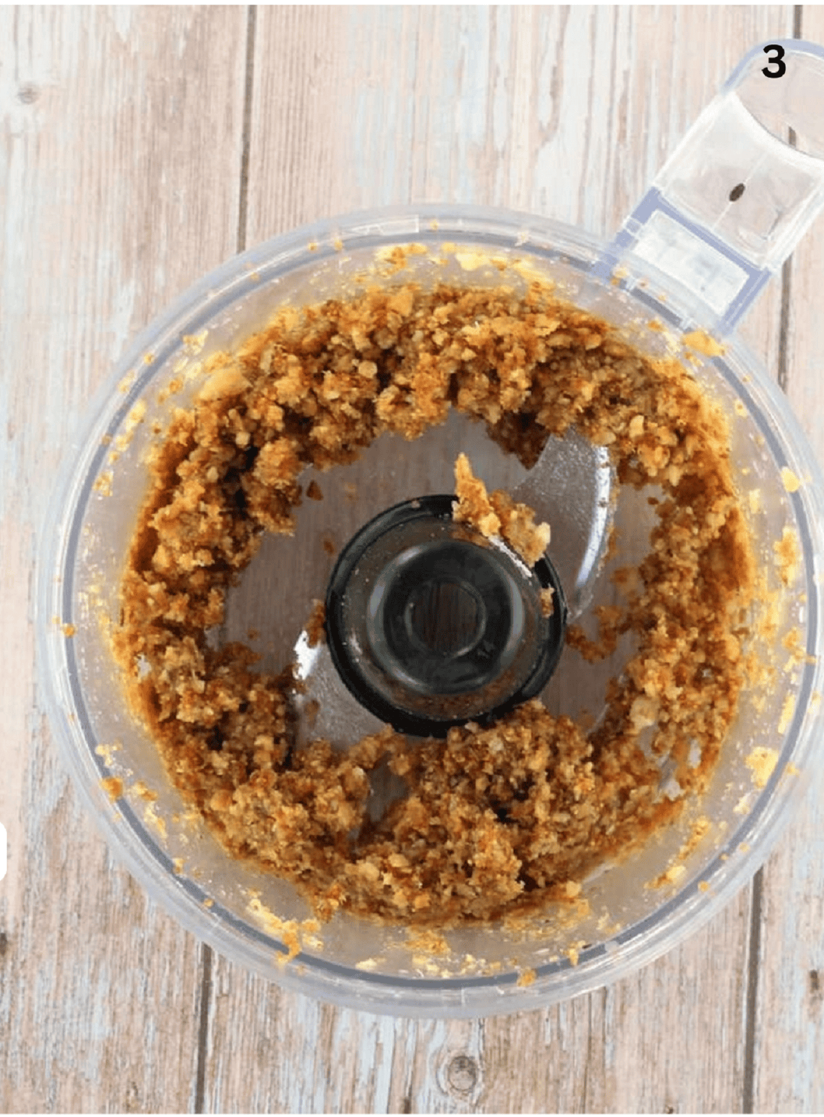 Figs, raisins, almonds processed in food processor bowl for cuccidati filling.