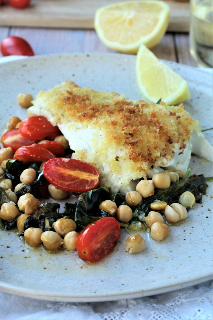Crispy oven baked fish with chickpeas,  spinach and tomatoes.