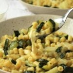 Spoonful of risotto style pasta with zucchini.