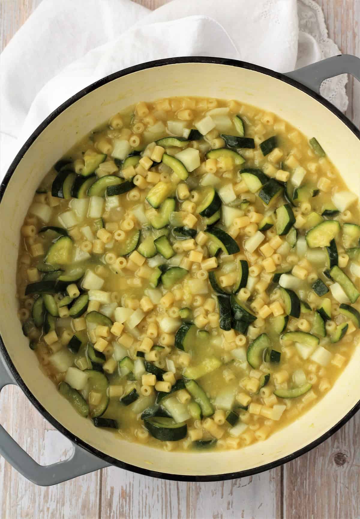 Zucchini risotto pasta in large skillet.