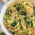 Large bowl filled with garlicky sautéed escarole spaghetti.