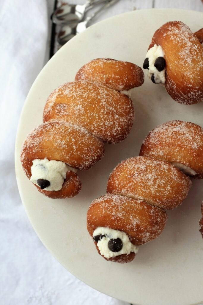 Cartocci Siciliani with ricotta cream and chocolate chips on plate.