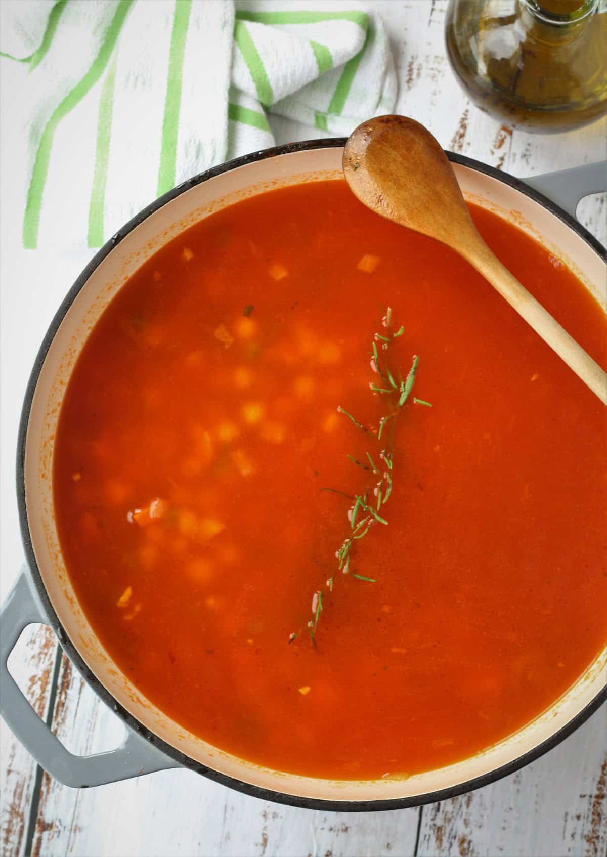 Vegetable broth added to creamy chickpeas with pasta recipe.