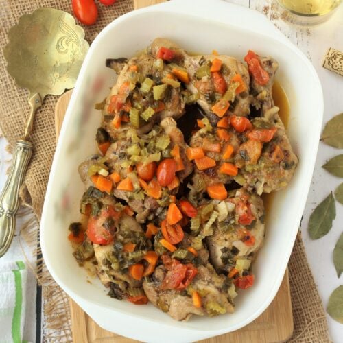 Sicilian chicken in sweet and sour sauce in casserole dish.