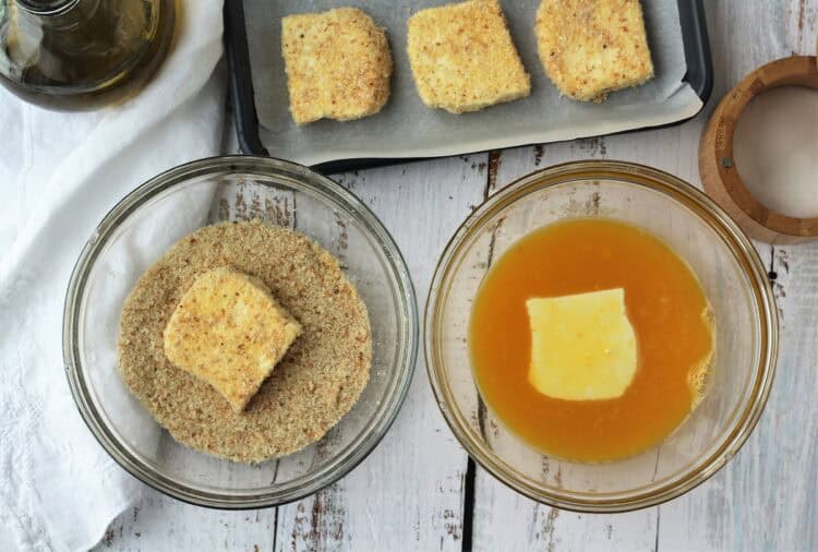 How to dredge tuma cheese in egg and breadcrumbs.