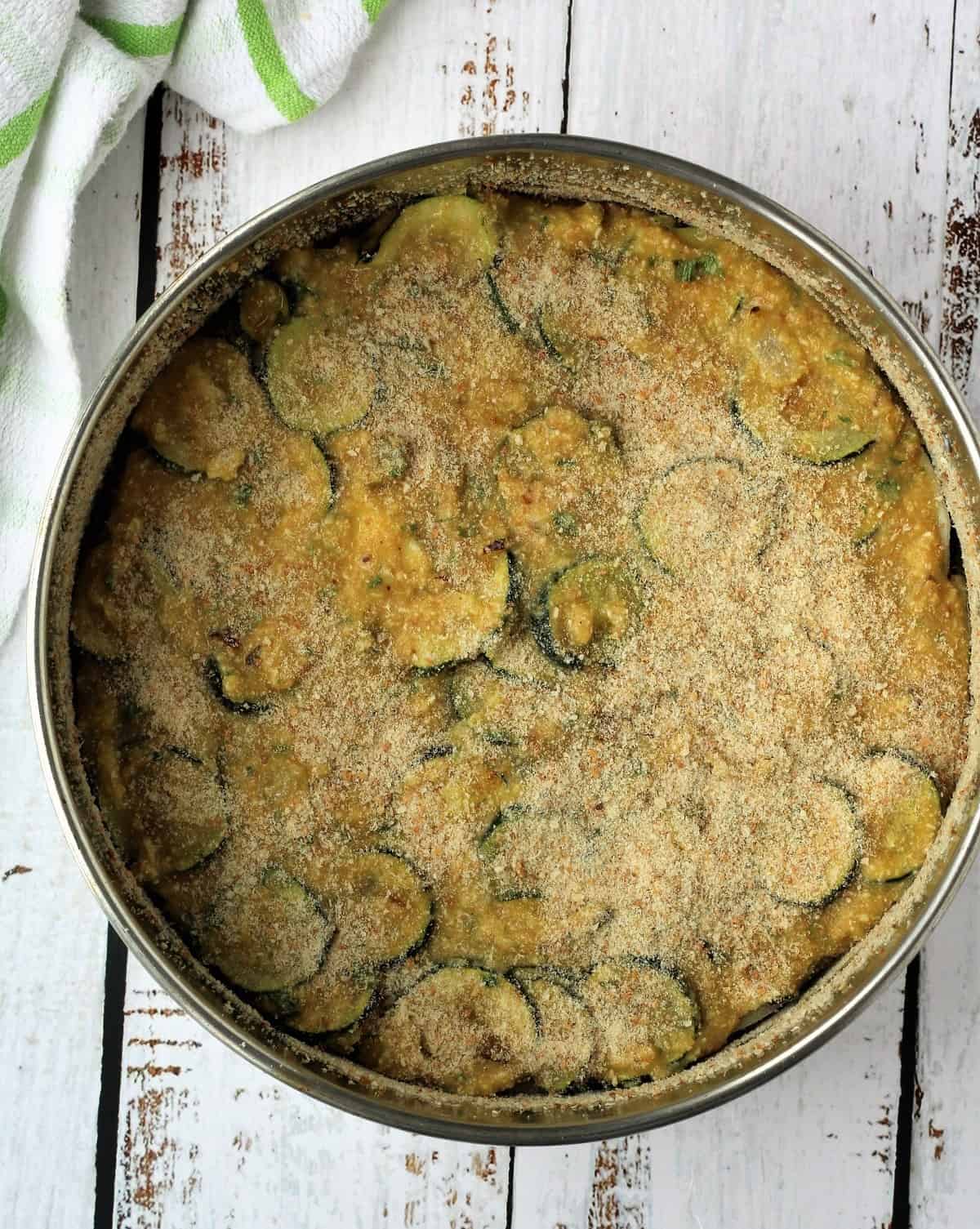 Zucchini frittata mixture in springform pan.