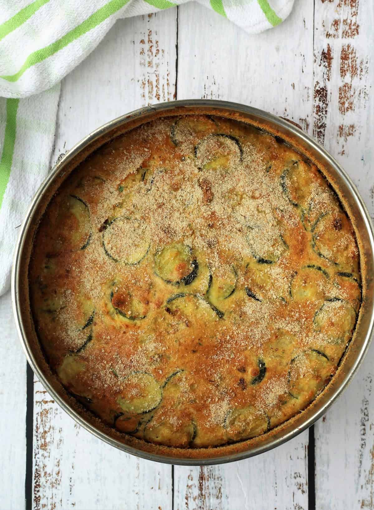 Cheesy baked zucchini frittata in springform pan.