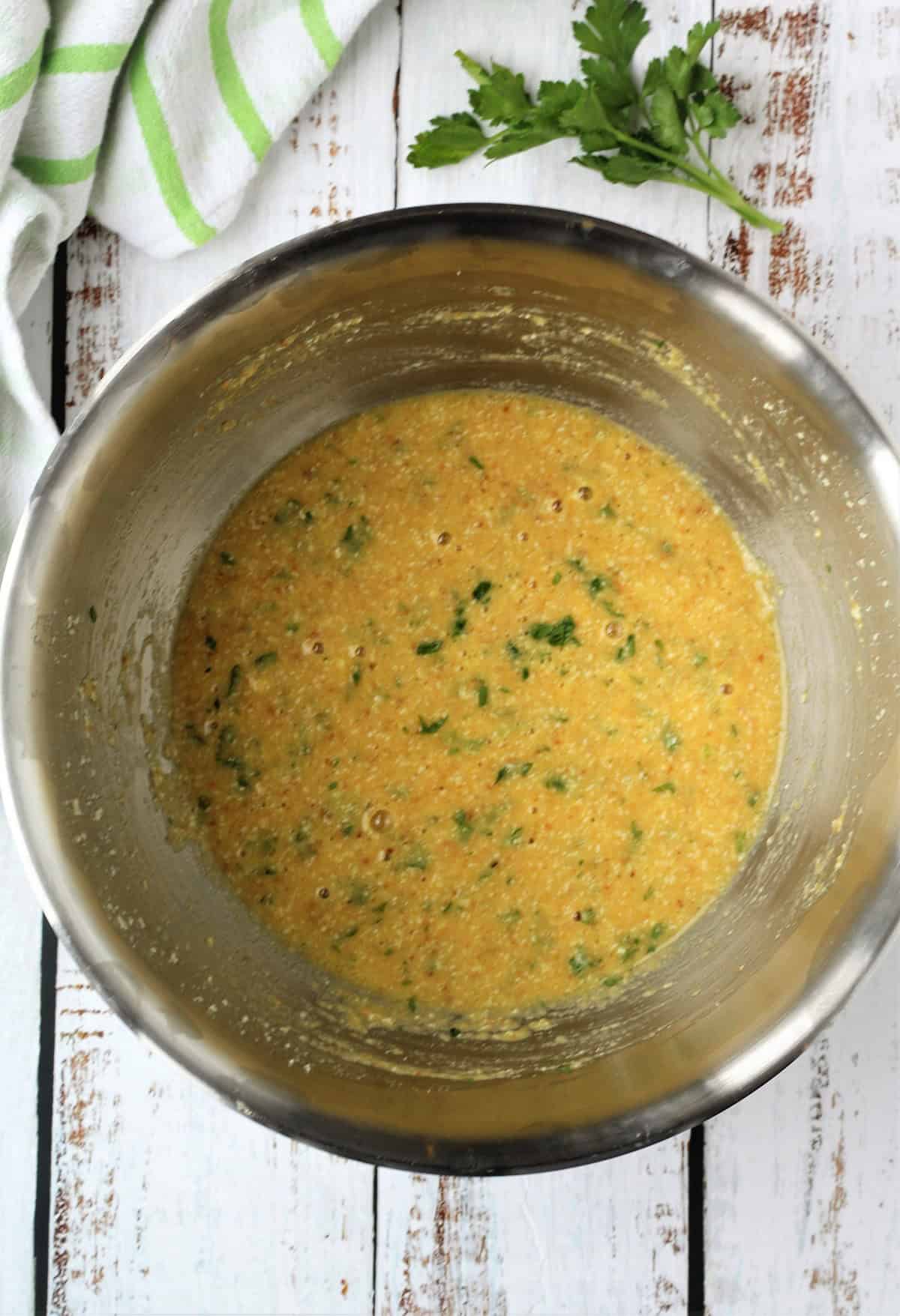 Zucchini frittata mixture in large bowl.