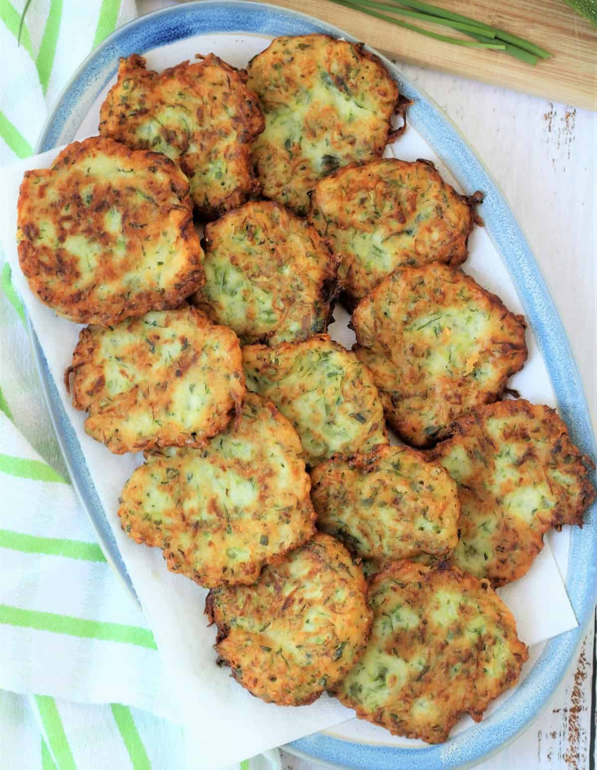 Italian zucchini fritters on oval serving plate.