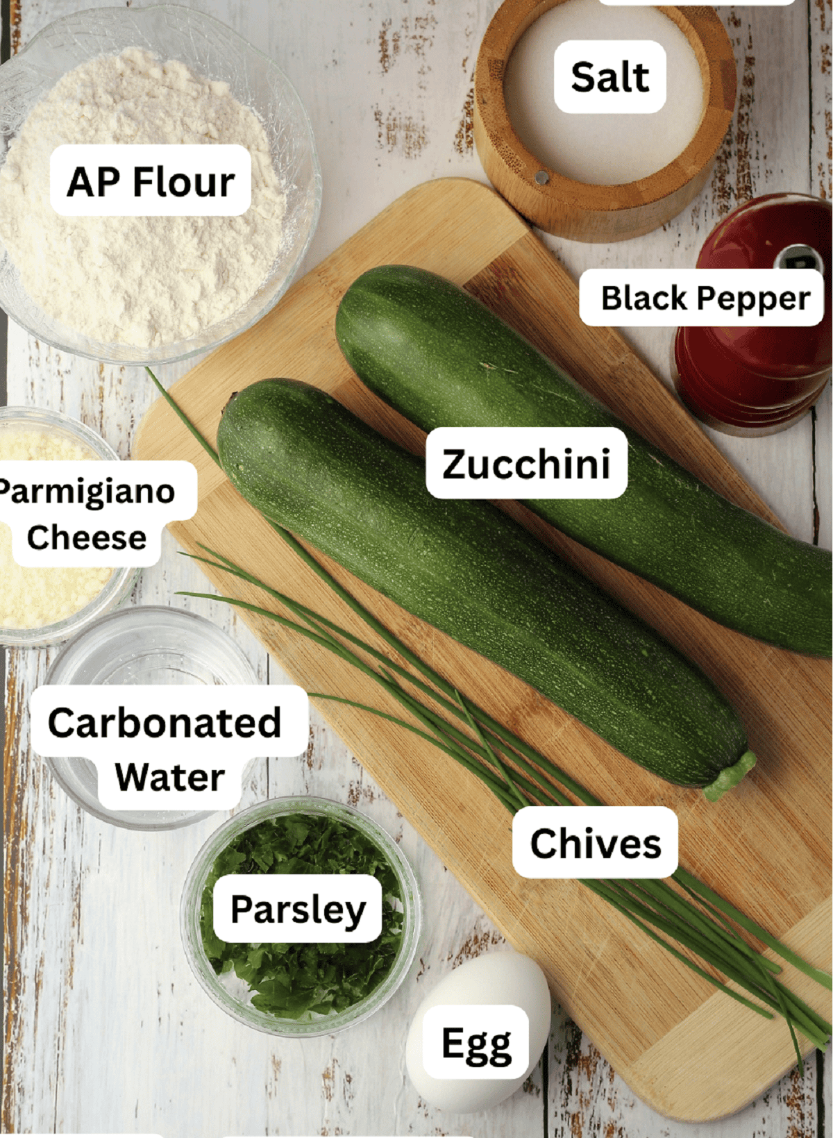 Zucchini, salt, pepper, chives, egg, parsley, carbonated water, cheese and AP flour.