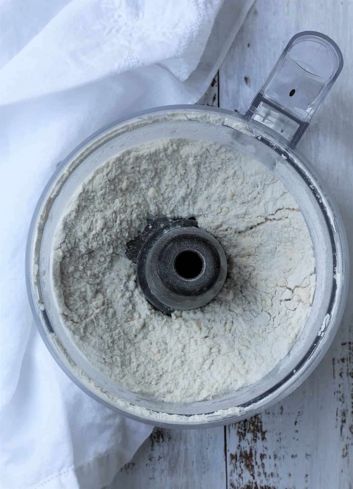Butter cut into flour for pastry dough.