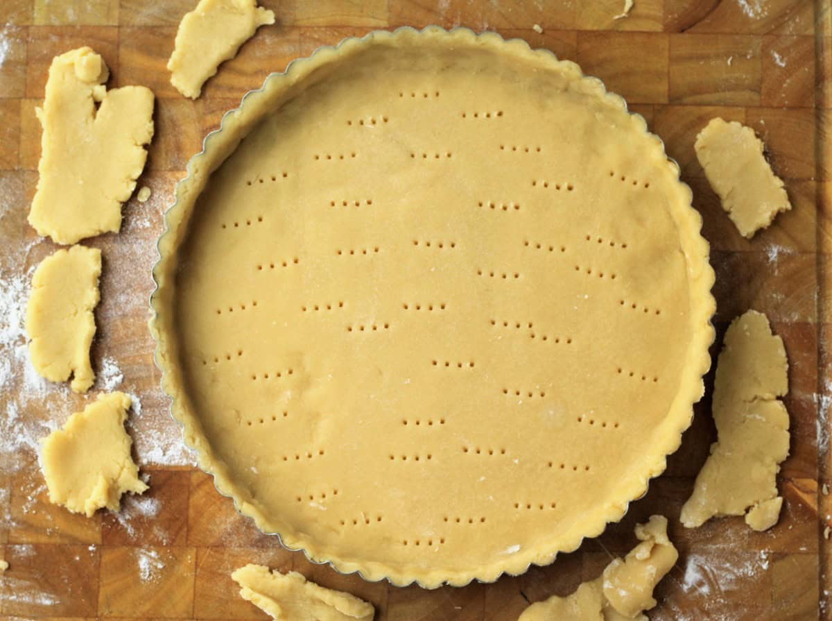 Pastry dough in tart shell.
