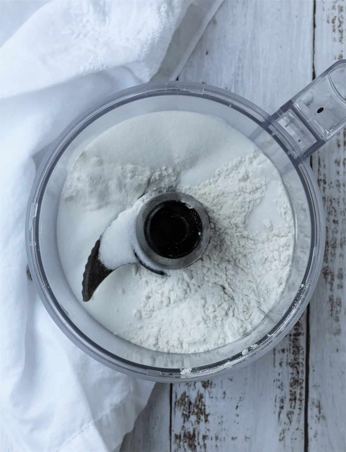 Flour in food processor bowl for pastry.