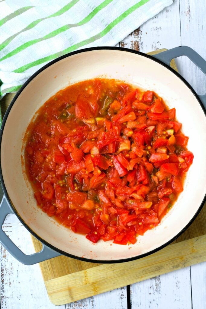 Diced tomatoes in large skillet.