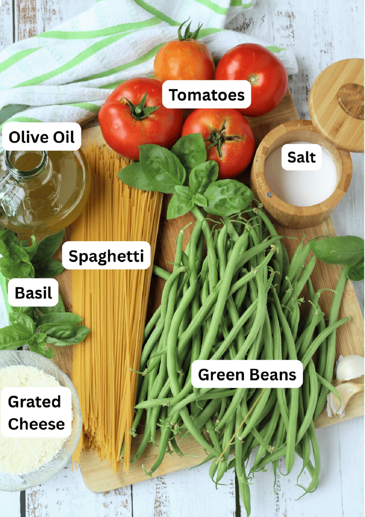 Green beans, spaghetti, grated cheese, basil, olive oil, tomatoes and salt.