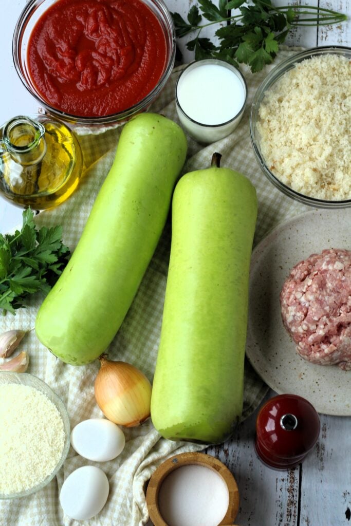 Cucuzza squash, ground meat, breadcrumbs, cheese, tomato sauce, eggs, oil, parsley, salt and pepper.