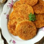 Baked butternut squash cutlets on plate.