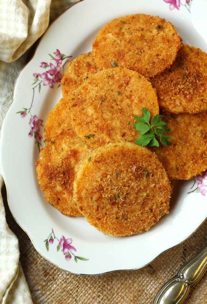 Baked butternut squash cutlets on plate.
