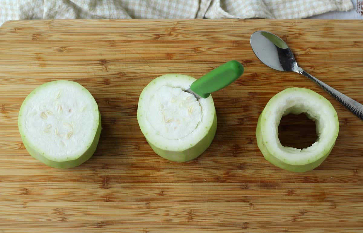How to remove seeds from cucuzza squash with knife and spoon.