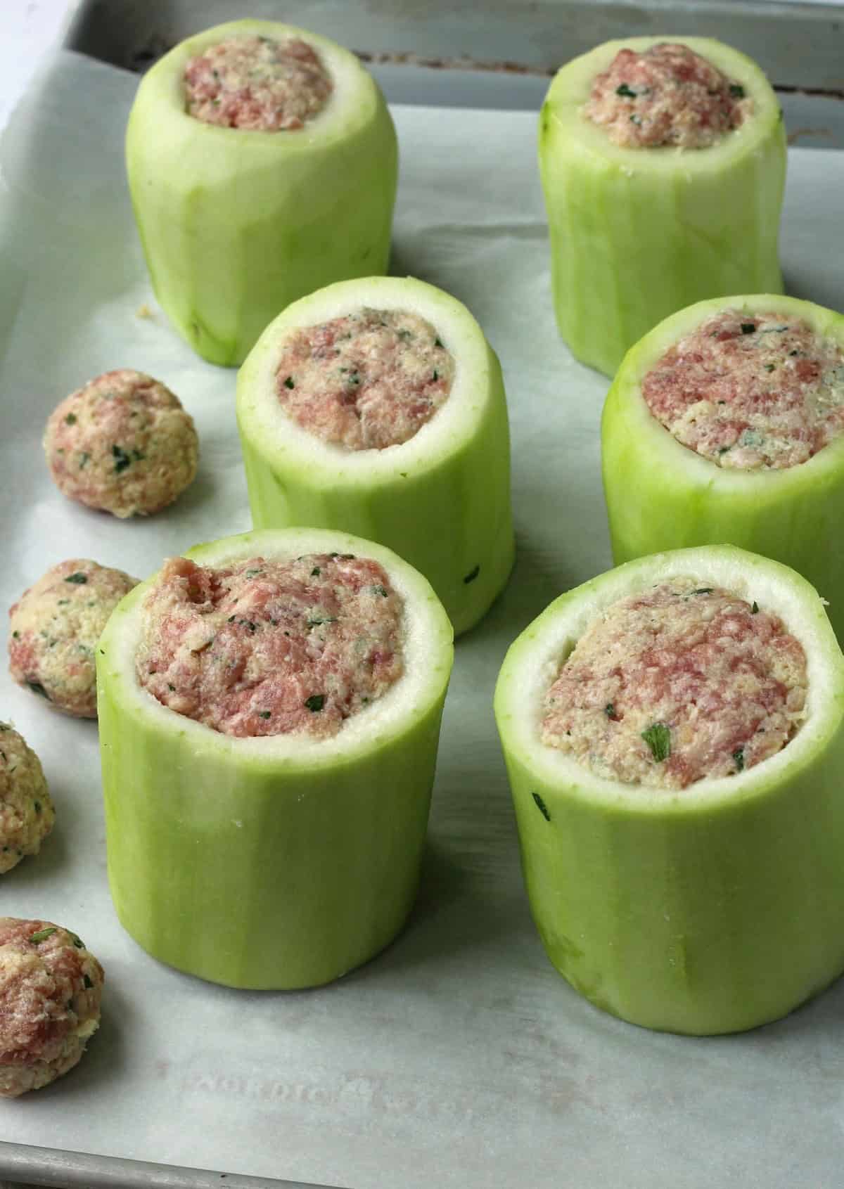 Stuffed cucuzza squash pieces with meatball stuffing.