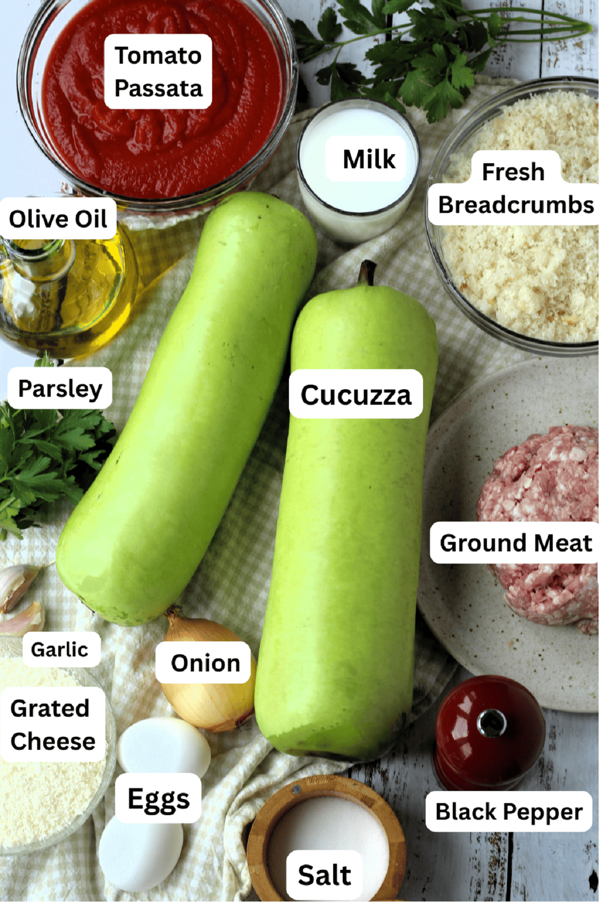 Cucuzza squash, breadcrumbs, ground meat, pepper, salt, eggs, onion, grated cheese, garlic, parsley, olive oil, tomato sauce and milk.