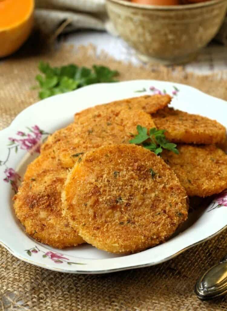 Crispy baked breaded squash on serving plate.