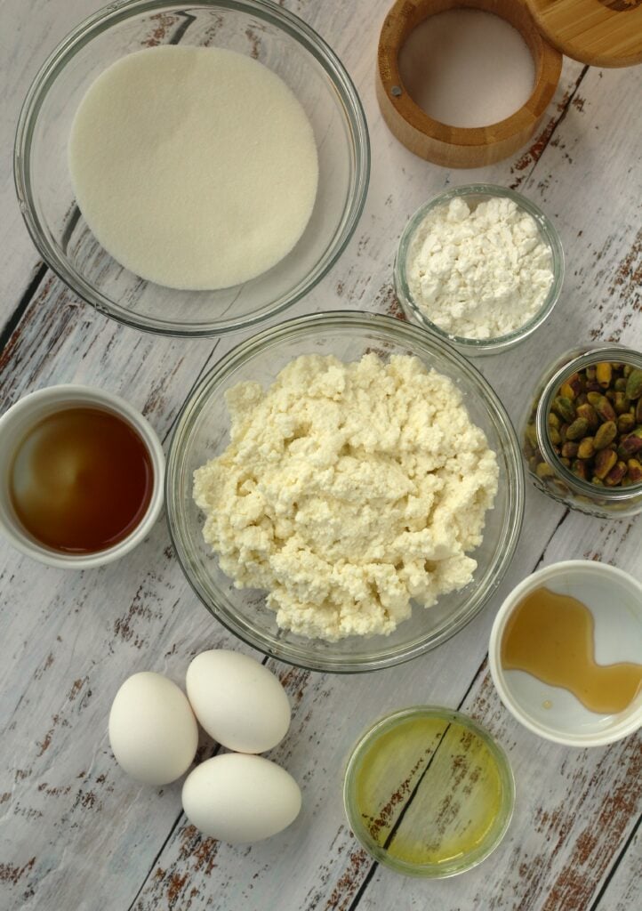 Bowl of ricotta, cornstarch, sugar, honey, pistachios, eggs, oil and vanilla extract.