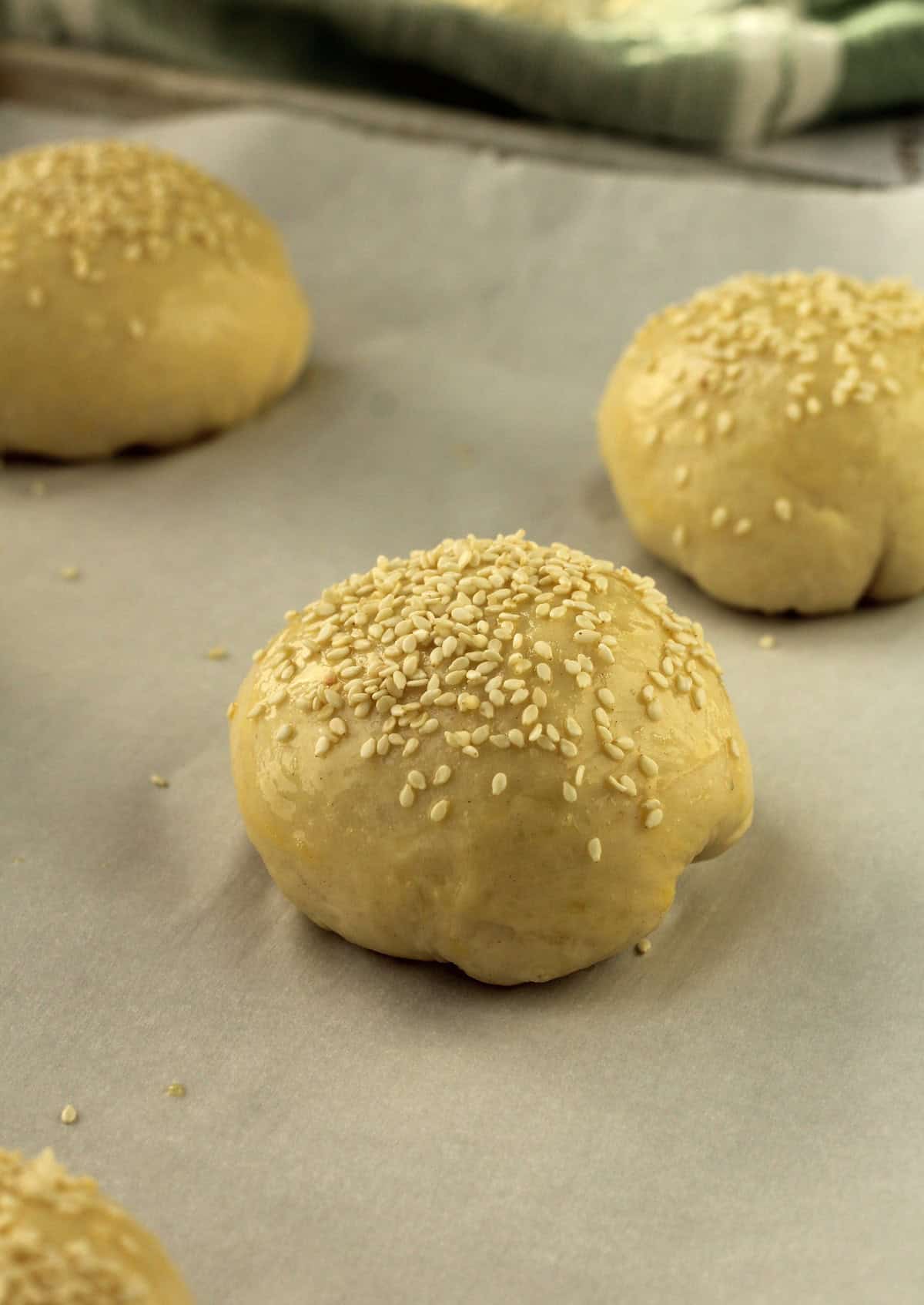 Ravazzate dough brushed with egg wash and topped with sesame seeds.