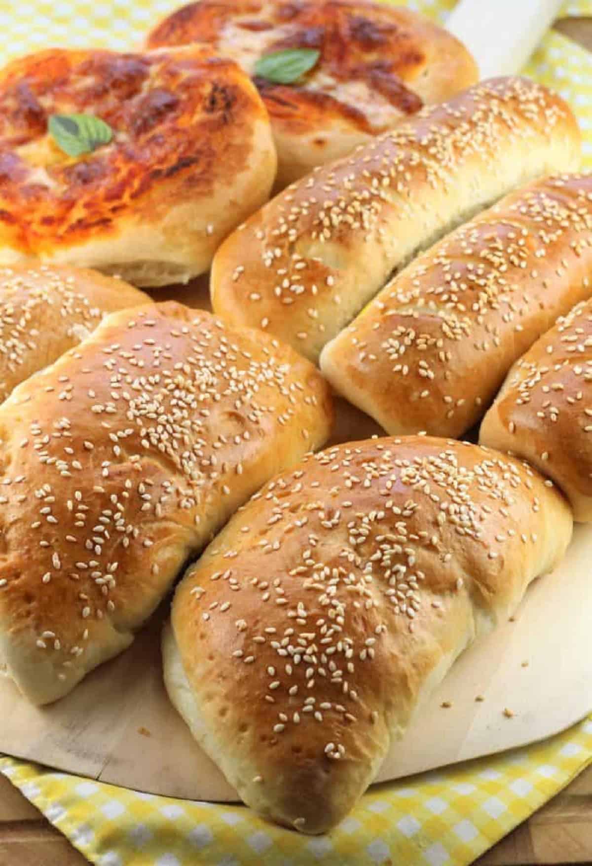 Sicilian pezzi di rosticceria (mini pizzas and calzone) on plate.