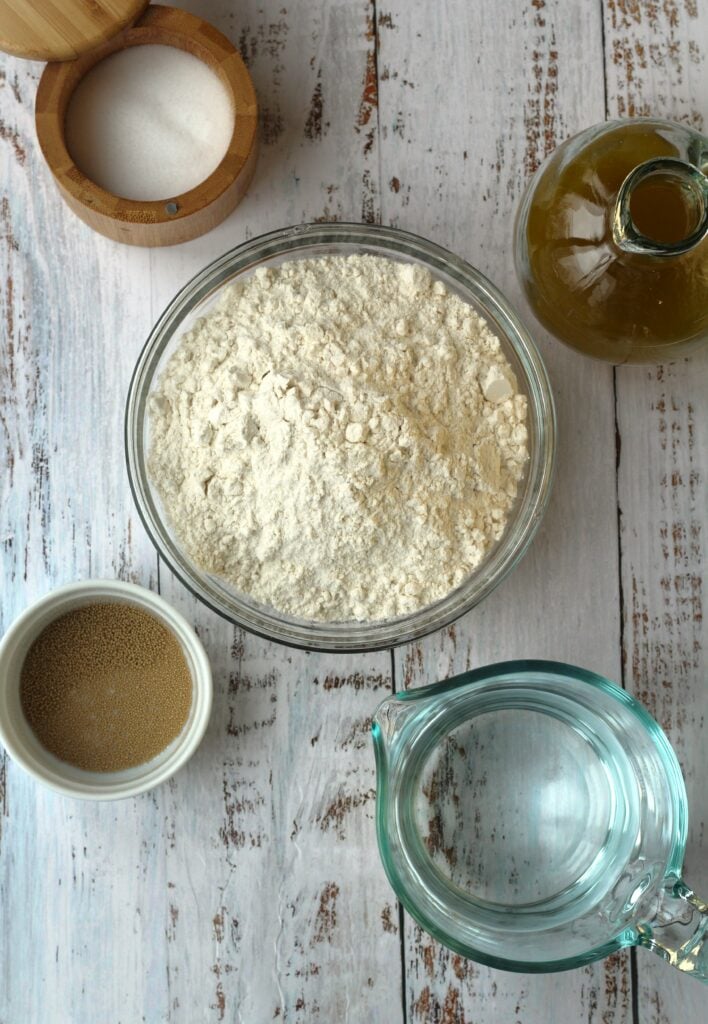 Bowl of flour, water, yeast, salt and olive oil.