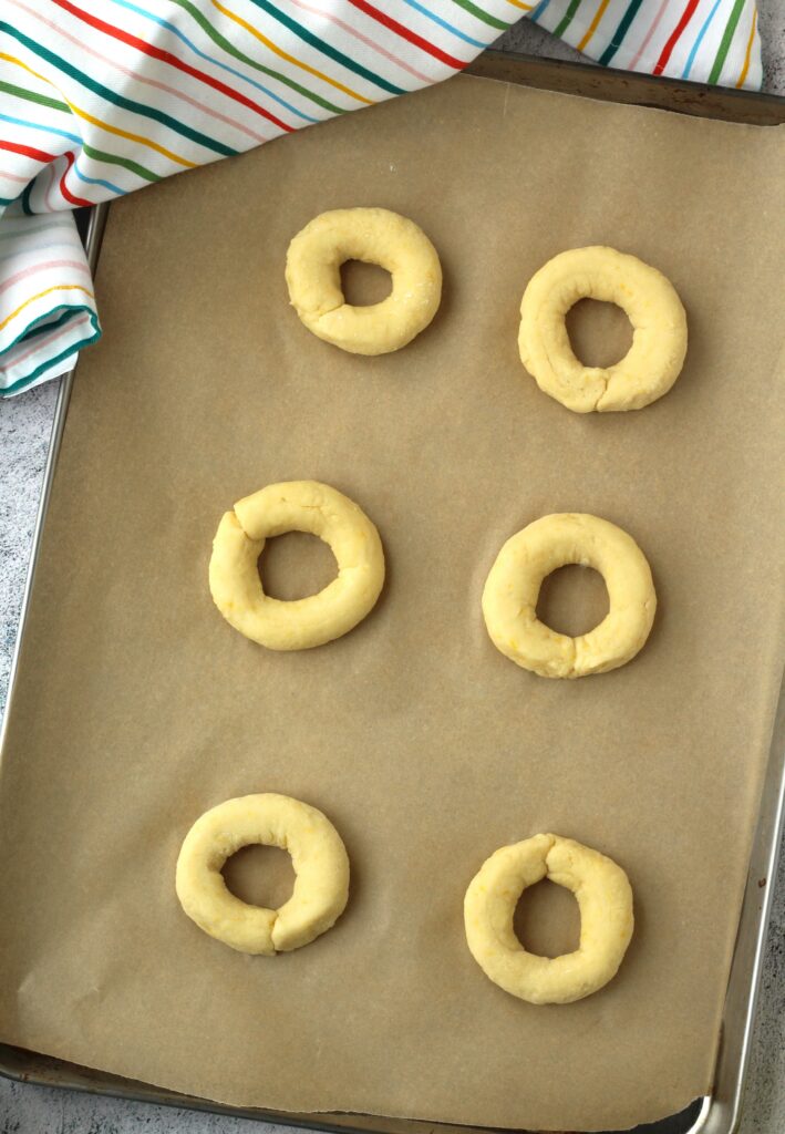 Ricotta ring cookies on baking sheet.