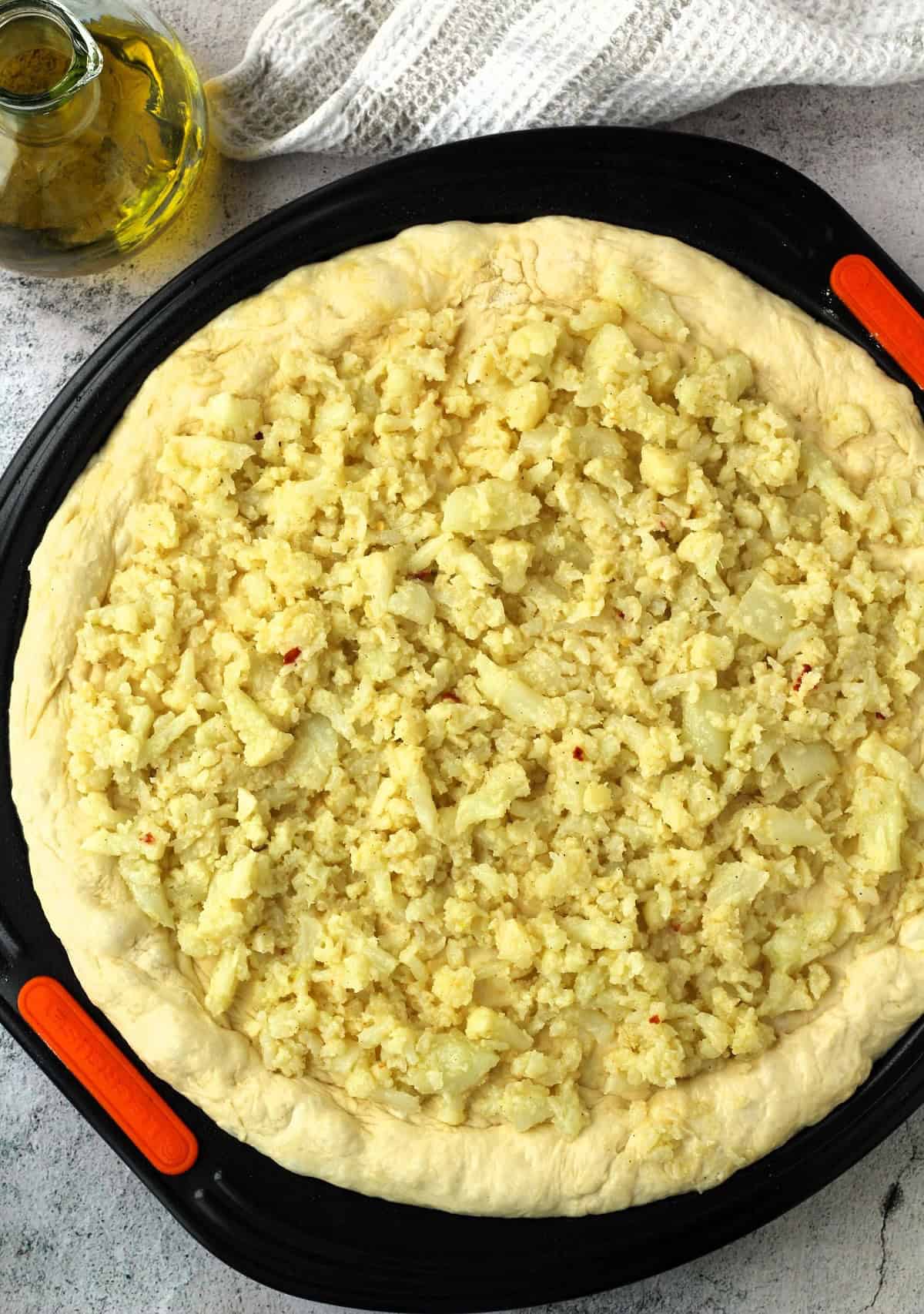 Cauliflower topped pizza crust.