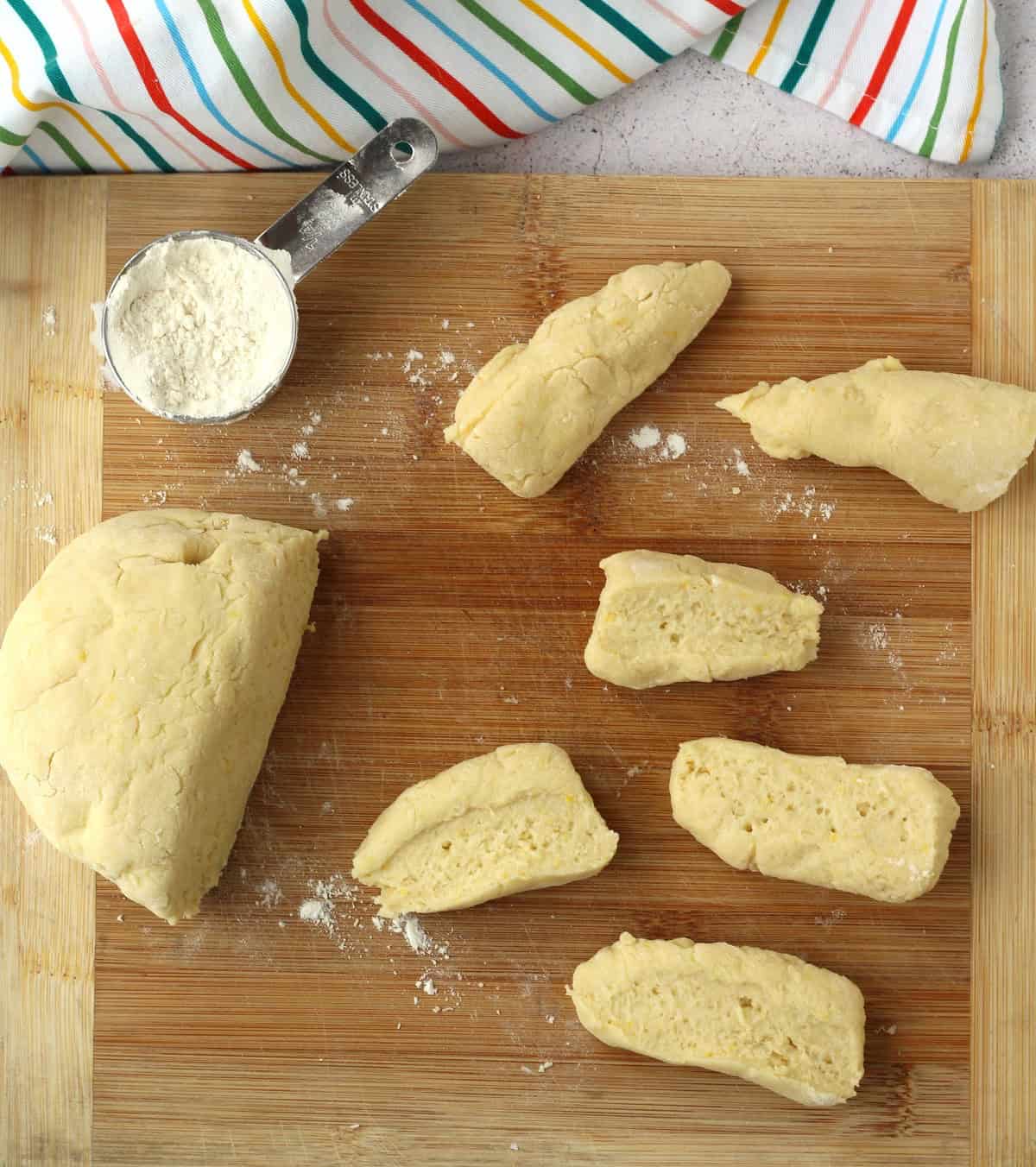 Ricotta ring cookie dough cut into pieces.