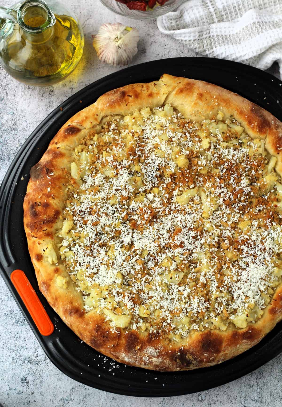 Cauliflower, muddica and ricotta salata topped pizza.