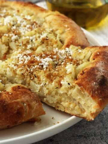 Pizza with cauliflower, crispy breadcrumbs and ricotta salata.