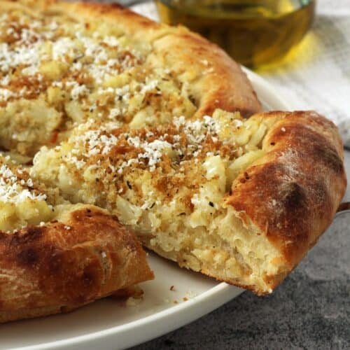 Pizza with cauliflower, crispy breadcrumbs and ricotta salata.