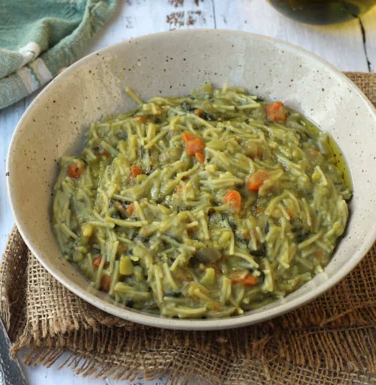 Sicilian fava bean soup with broken up spaghetti in bowl.