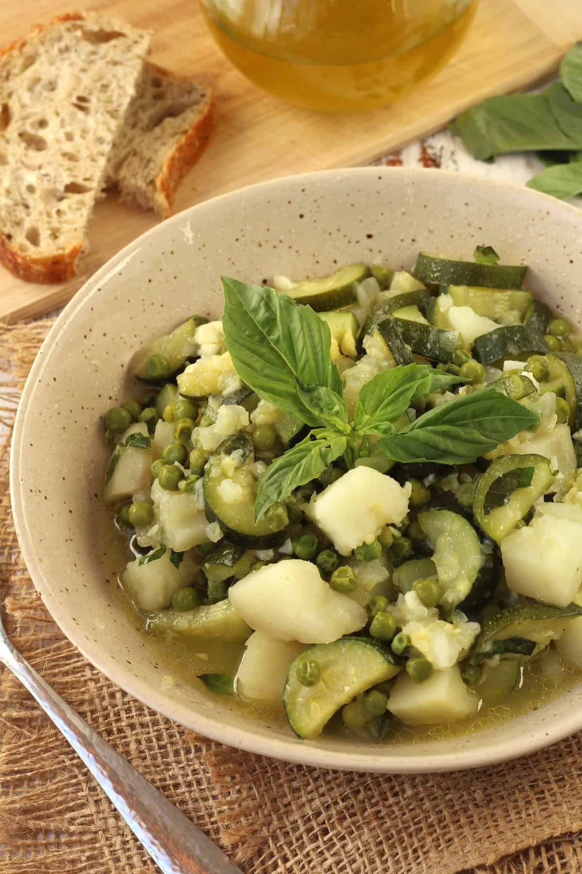 Stewed zucchini with potatoes and peas
