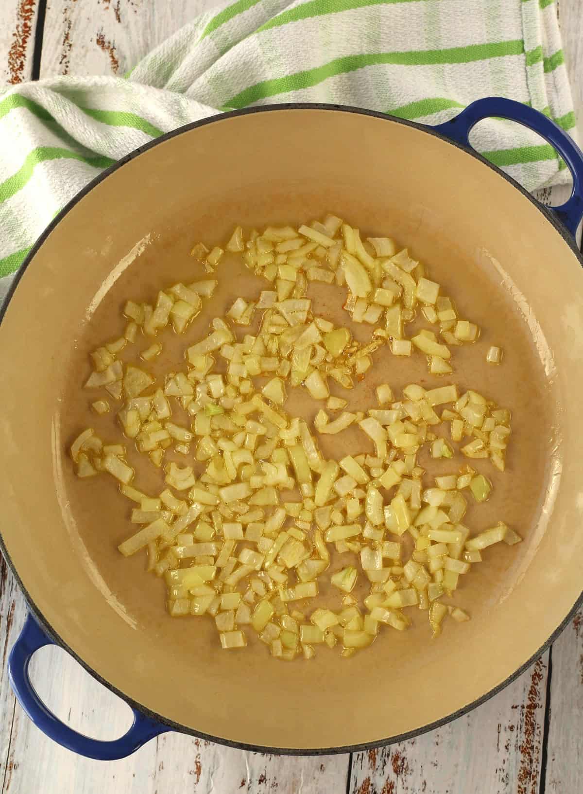 Sautéed diced onion in olive oil in large skillet.
