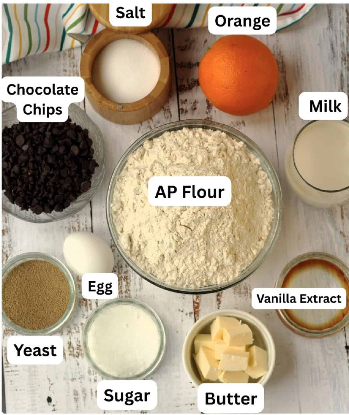 Orange, milk, vanilla, butter, sugar, egg, yeast, chocolate chips, salt and flour.