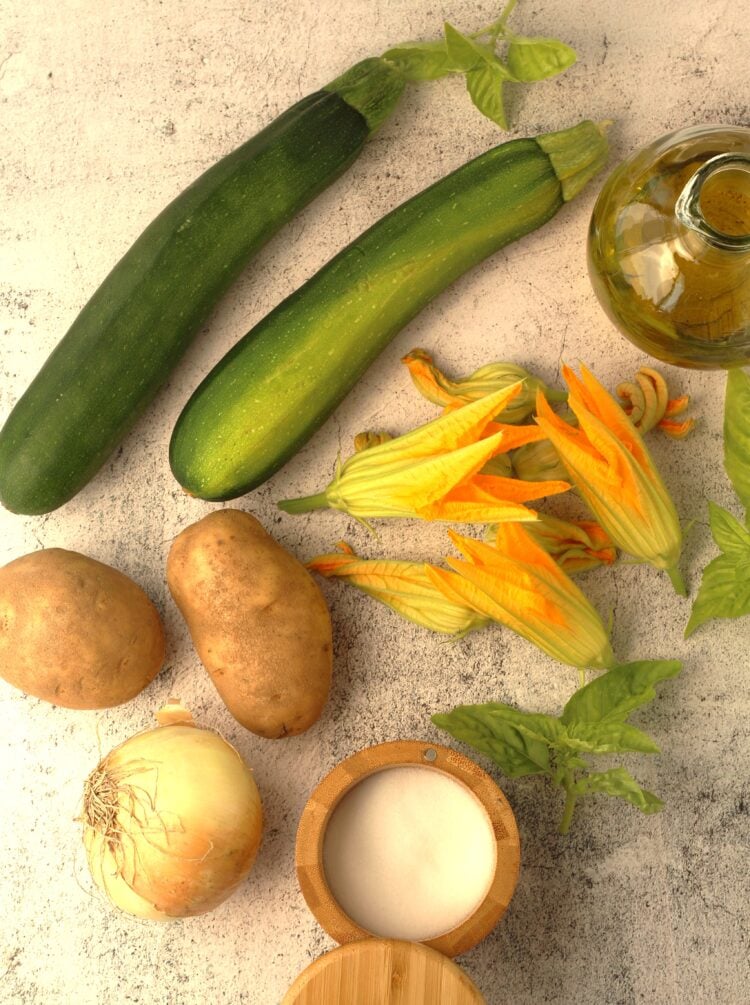 Zucchini, zucchini flowers, potatoes, onion, basil, salt and olive oil.