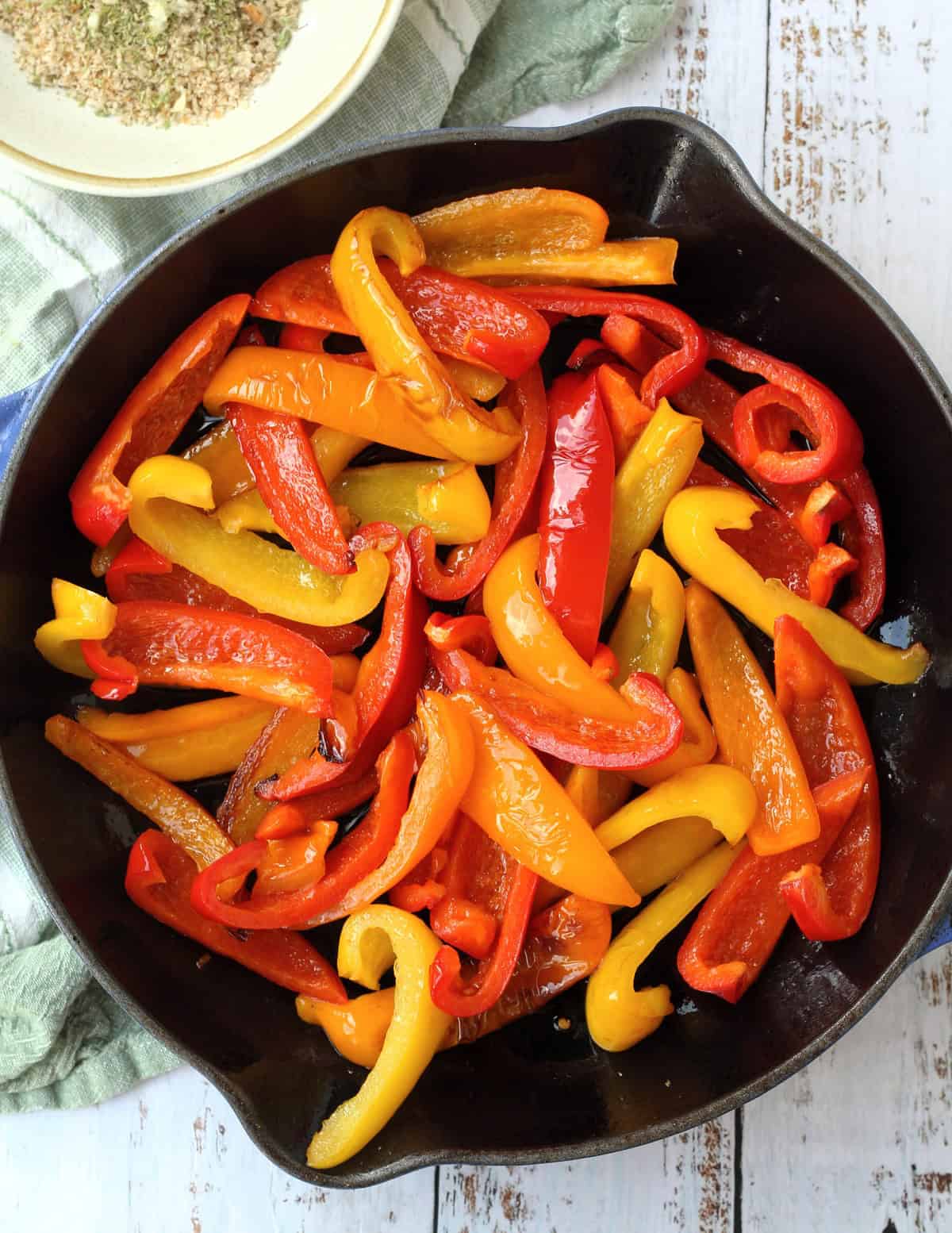 Sautéed peppers in cast iron skillet.
