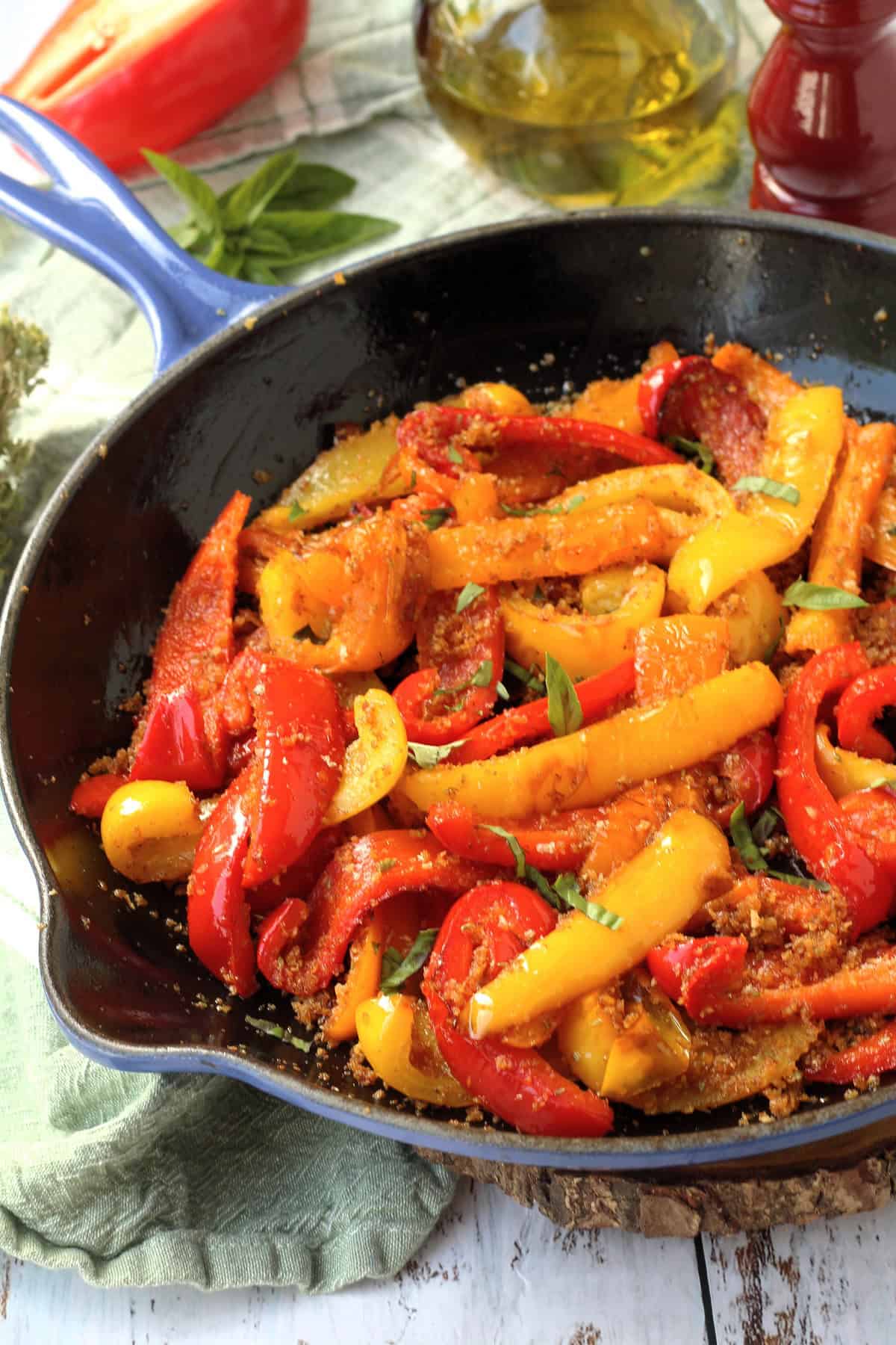 Peppers with breadcrumbs in cast iron skillet.