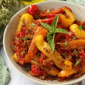 Bowl of peperoni ammollicati topped with basil.