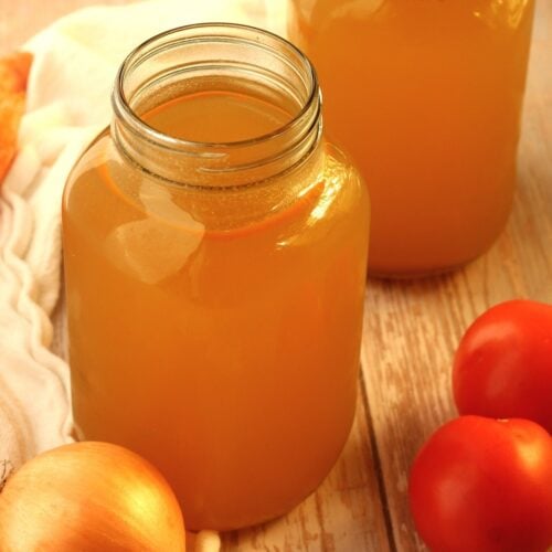 Homemade vegetable broth in mason jars.