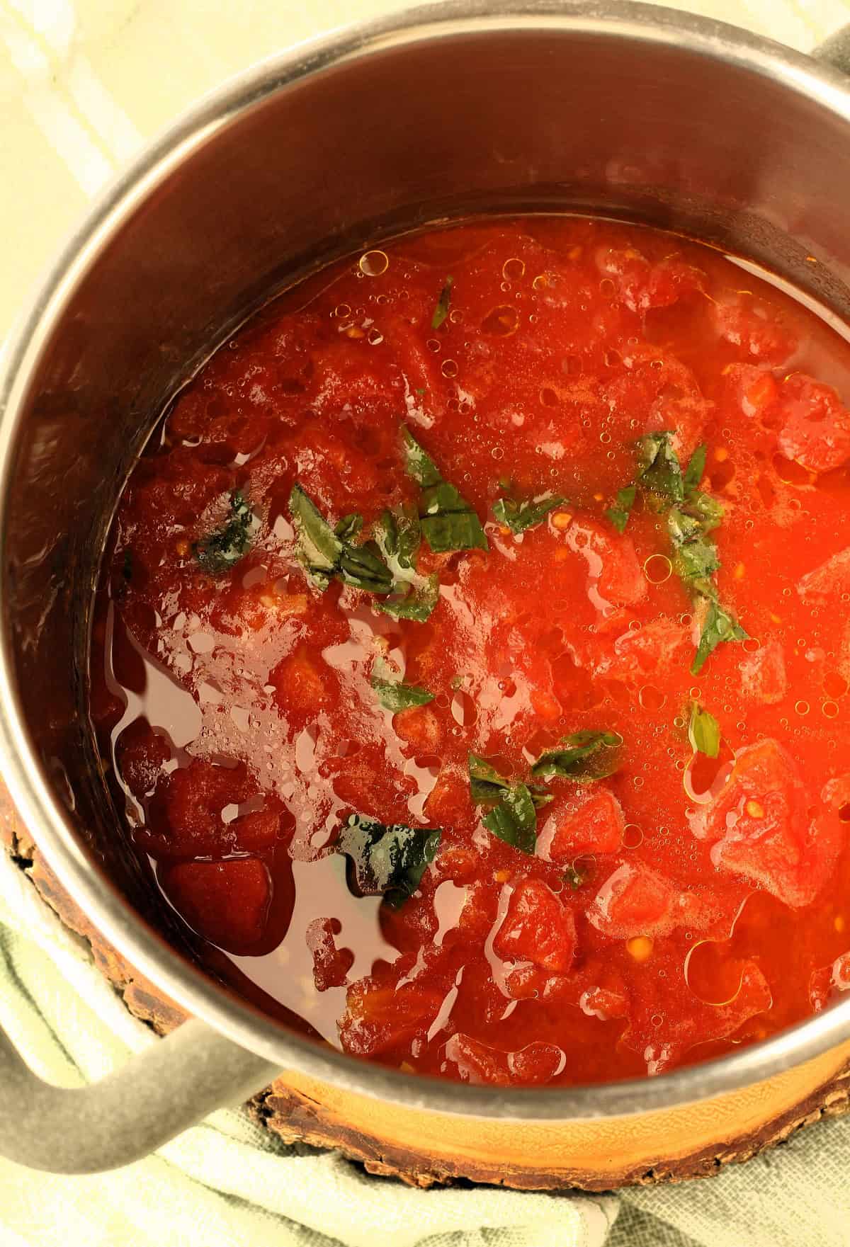 Tomato sauce with fresh basil for swiss chard rolls.