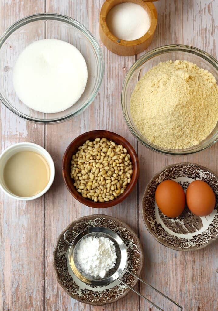 Almond flour, sugar, eggs, almond extract, salt, pine nuts and powdered sugar.