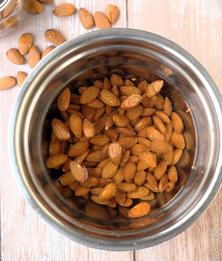 Almonds in bowl covered with water for dairy free ricotta.